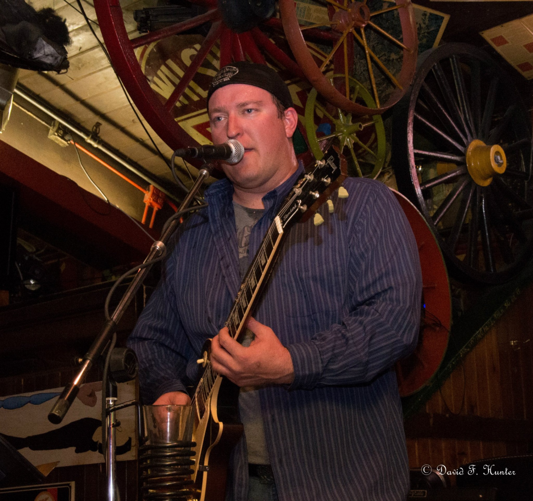 Nick playing at a pub stage