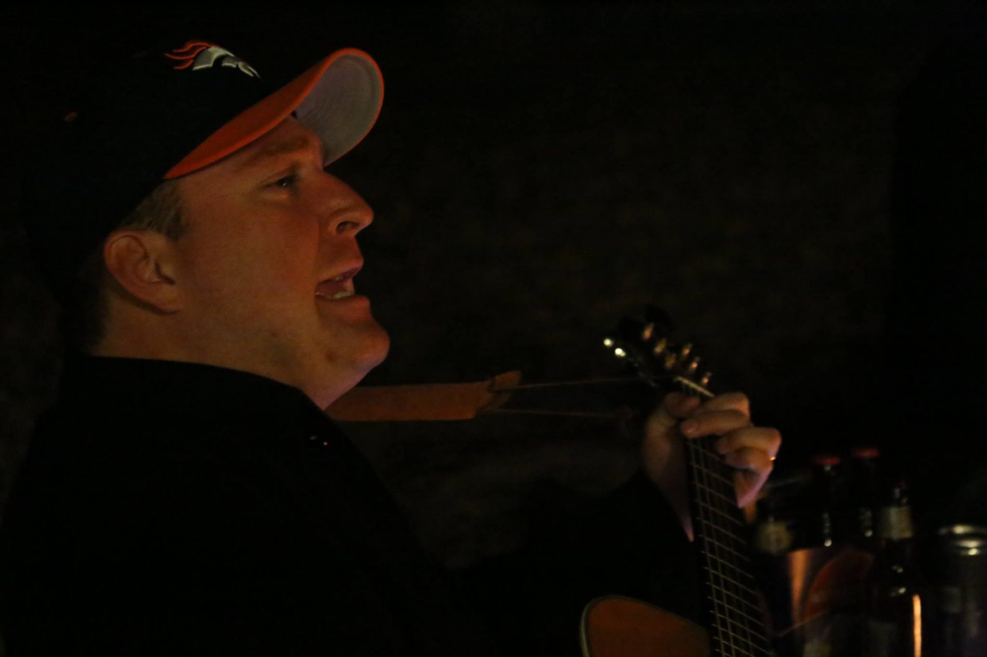 Nick singing with guitar